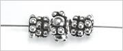 sterling silver rondelles and one beaded rondelle, strung onto beading wire.